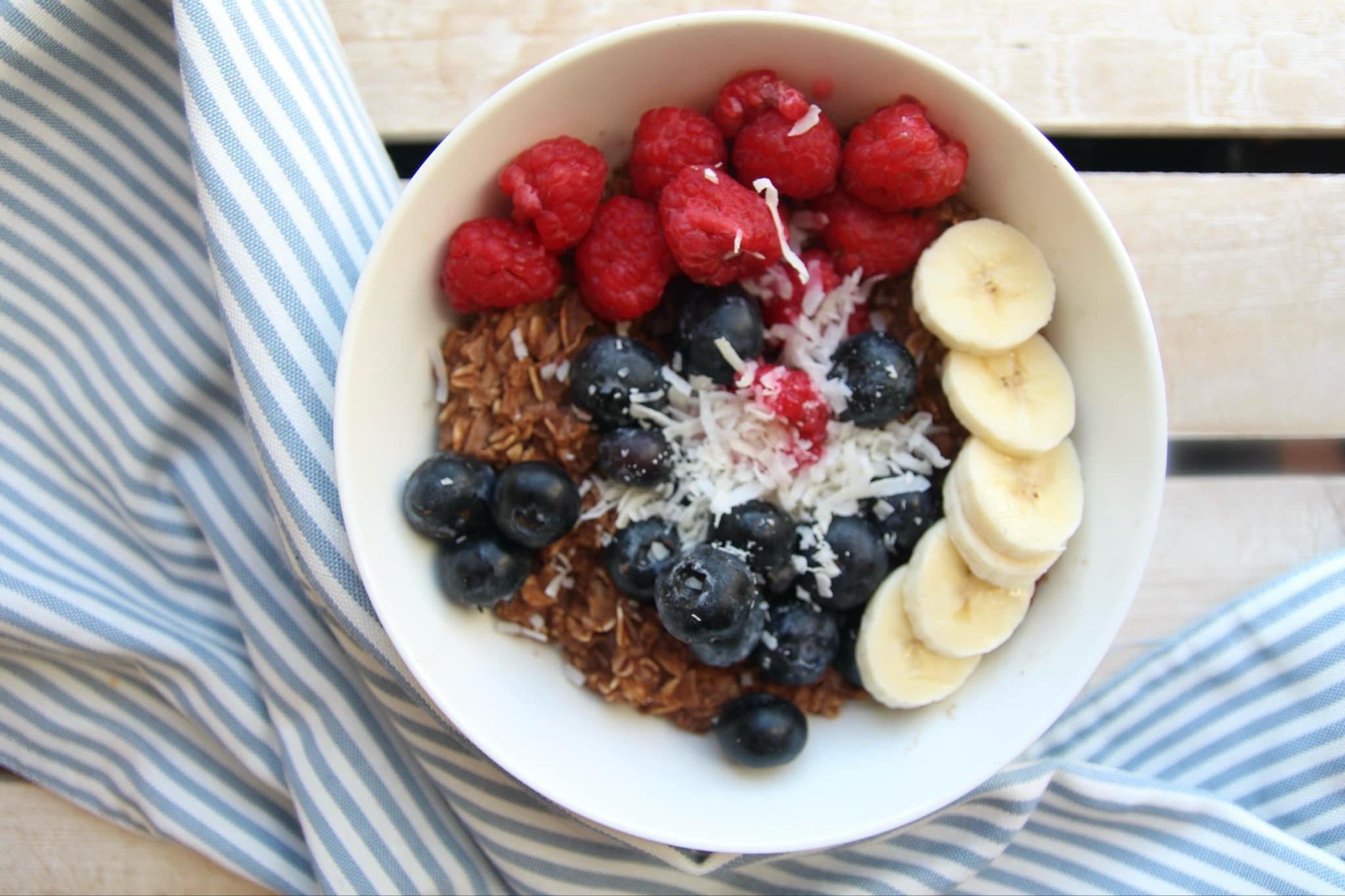 Chocolate and coconut oats with raspberries, blueberries and banana