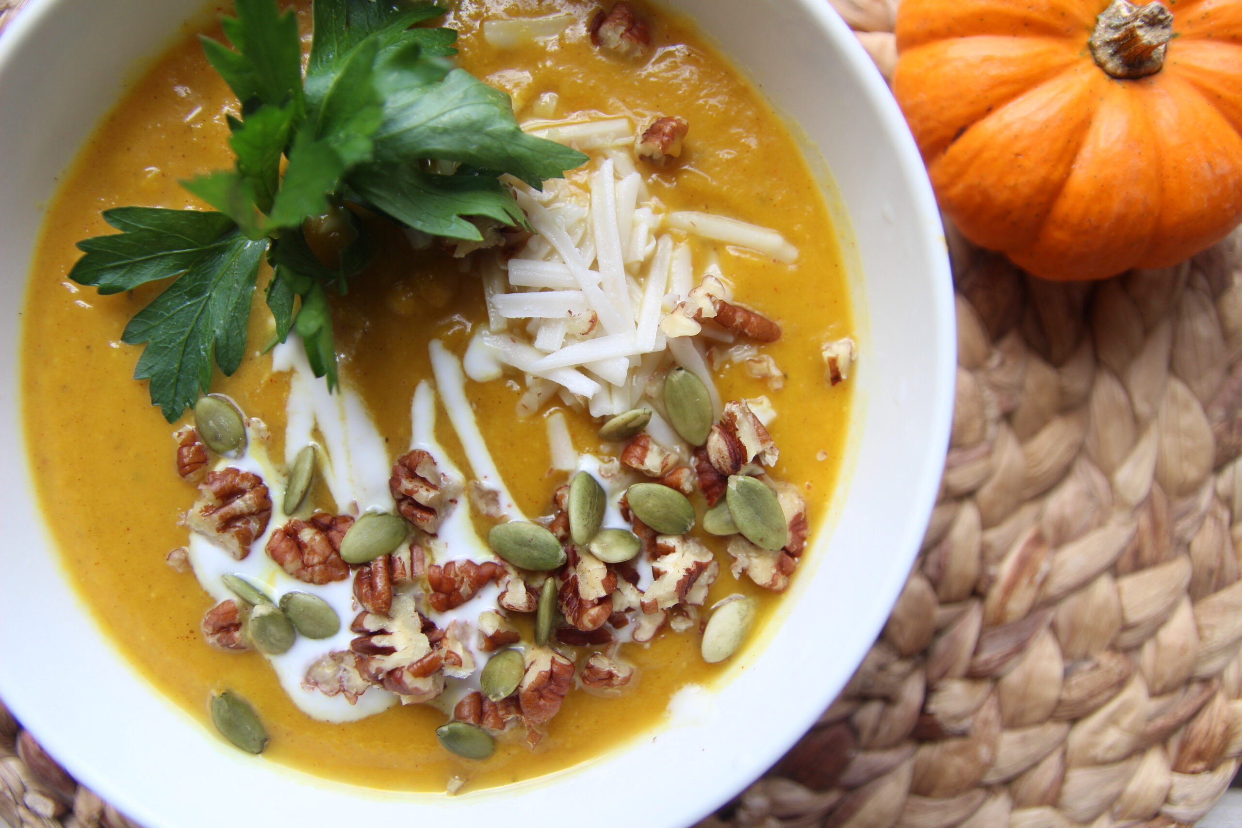 PUMPKIN SOUP WITH CASHEW CHEESE AND PECANS